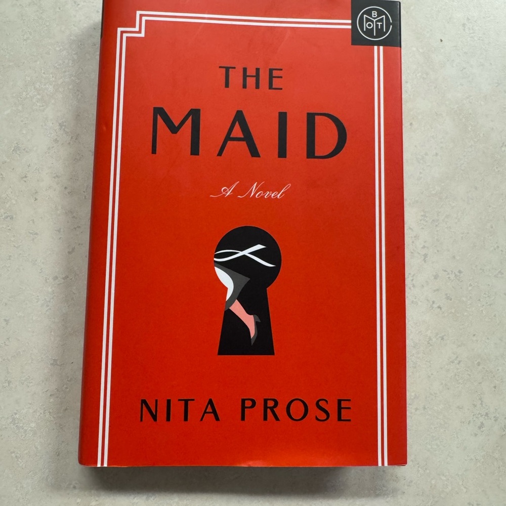 The Maid by Nita Prose - Red Hardcover Book